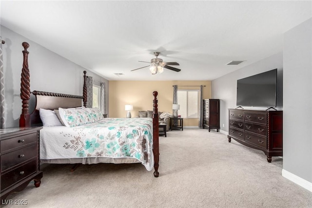carpeted bedroom featuring a ceiling fan, baseboards, and visible vents