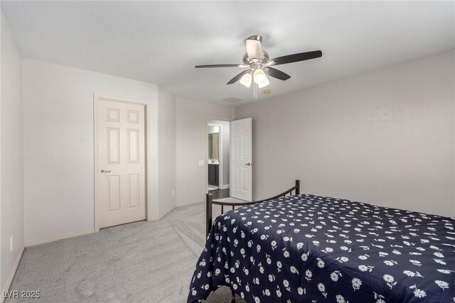 carpeted bedroom featuring baseboards and ceiling fan