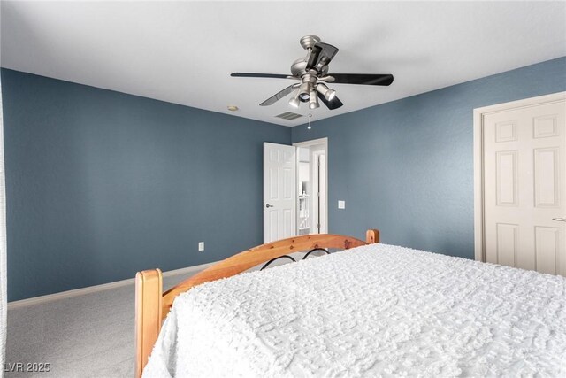 carpeted bedroom featuring baseboards, ceiling fan, and visible vents