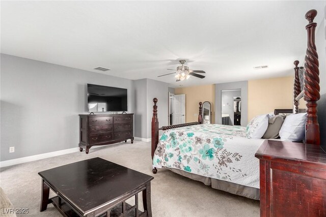 carpeted bedroom featuring baseboards, ceiling fan, and visible vents