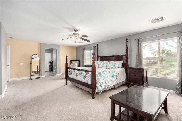 bedroom featuring visible vents, baseboards, and multiple windows
