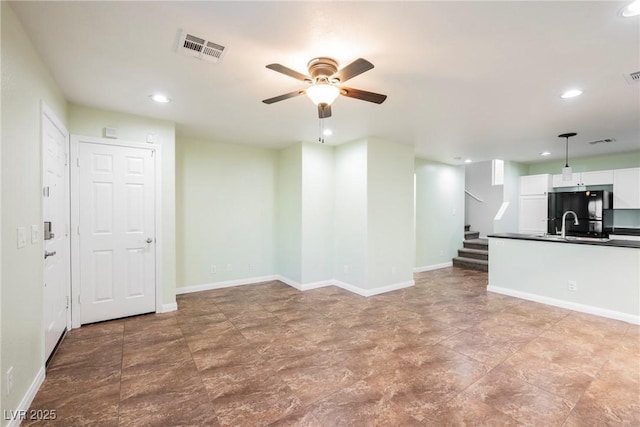7649 Calico Fields St, Las Vegas, NV 89149 - unfurnished living room with baseboards, ceiling fan, and recessed lighting