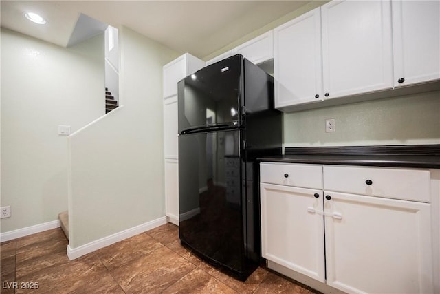 7649 Calico Fields St, Las Vegas, NV 89149 - kitchen featuring freestanding refrigerator, white cabinetry, baseboards, dark countertops, and recessed lighting