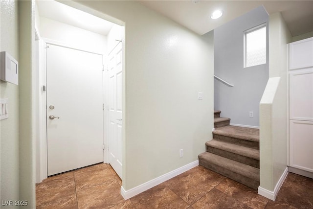 7649 Calico Fields St, Las Vegas, NV 89149 - entrance foyer with stone finish floor, baseboards, and stairway