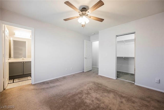 7649 Calico Fields St, Las Vegas, NV 89149 - unfurnished bedroom with connected bathroom, a sink, baseboards, ceiling fan, and carpet