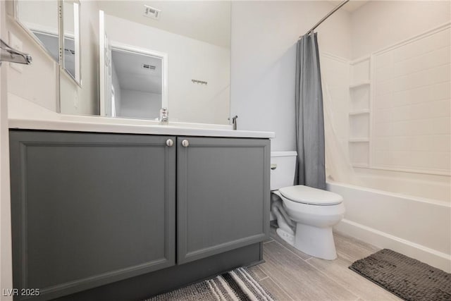 7649 Calico Fields St, Las Vegas, NV 89149 - full bath with toilet, vanity, wood finished floors, shower / tub combo, and visible vents