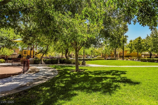 7649 Calico Fields St, Las Vegas, NV 89149 - view of property's community featuring fence, playground community, and a yard
