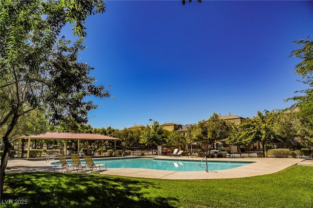 7649 Calico Fields St, Las Vegas, NV 89149 - community pool with a patio, fence, and a yard