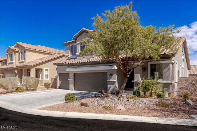 view of front of property featuring driveway, stucco siding, a tiled roof, and a garage