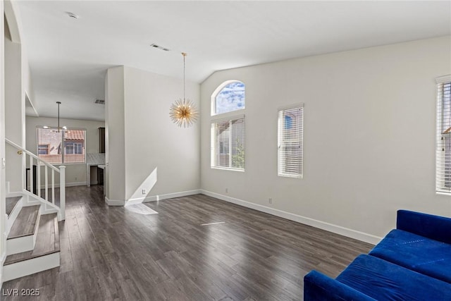 living area with stairway, vaulted ceiling, baseboards, dark wood-style floors, and visible vents