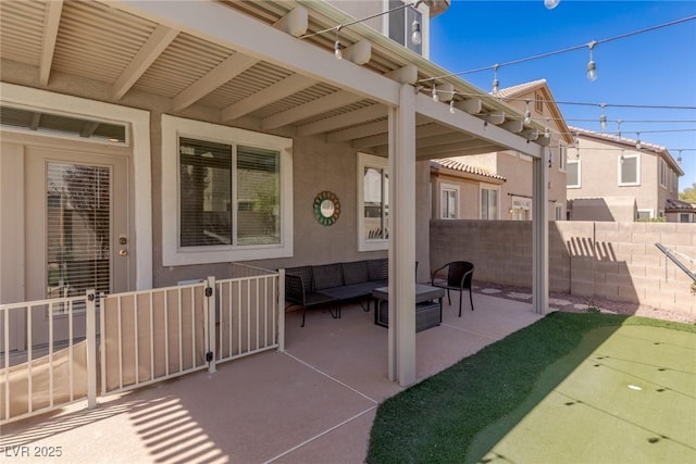 view of patio / terrace with outdoor lounge area and fence