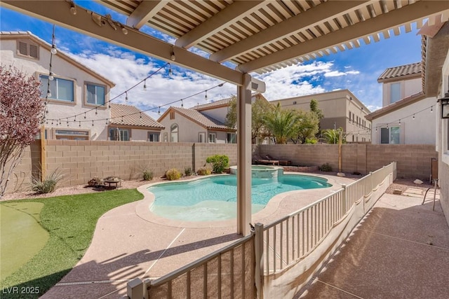 view of pool with a fenced backyard, a pool with connected hot tub, a residential view, and a patio area