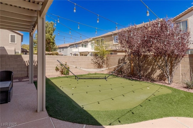 view of patio / terrace featuring a fenced backyard and a residential view