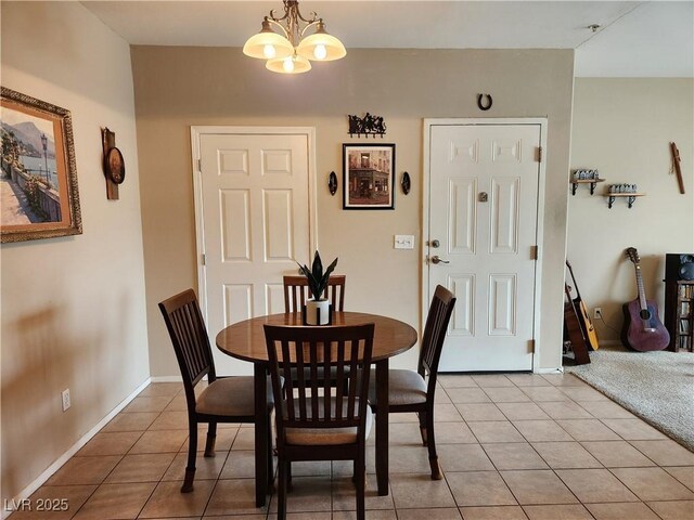 3550 Bay Sands Dr Unit 3077, Laughlin, NV 89029 - dining room featuring an inviting chandelier, light tile patterned floors, and baseboards