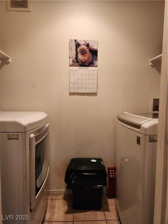 3550 Bay Sands Dr Unit 3077, Laughlin, NV 89029 - laundry area featuring light tile patterned floors, laundry area, and washer and clothes dryer