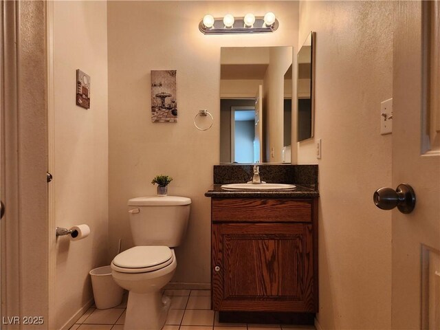 3550 Bay Sands Dr Unit 3077, Laughlin, NV 89029 - half bath featuring baseboards, toilet, tile patterned flooring, and vanity