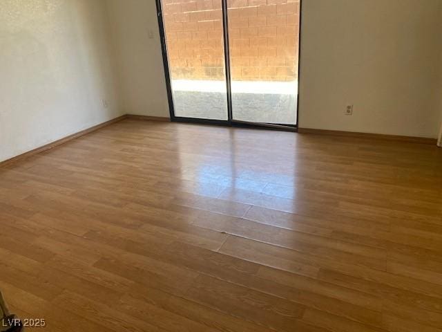 7732 Blackbird Ave, Las Vegas, NV 89145 - unfurnished room featuring wood finished floors