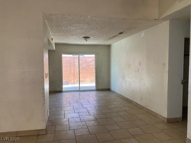 7732 Blackbird Ave, Las Vegas, NV 89145 - unfurnished room featuring a textured ceiling and baseboards