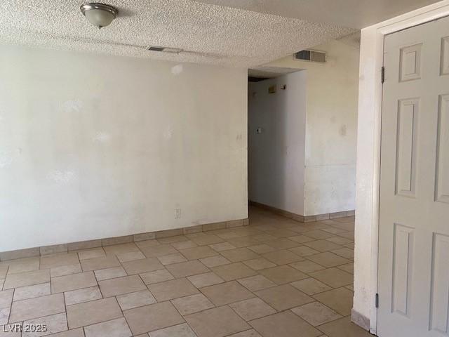 7732 Blackbird Ave, Las Vegas, NV 89145 - spare room with a textured ceiling