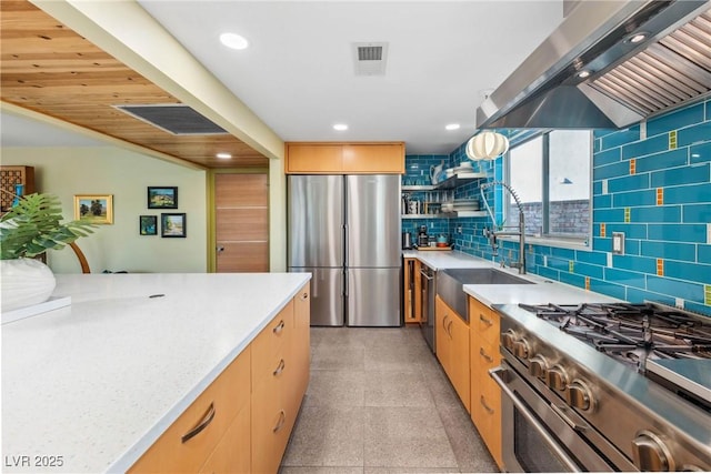3586 Spencer St, Las Vegas, NV 89169 - kitchen featuring light countertops, range hood, stainless steel appliances, visible vents, and recessed lighting