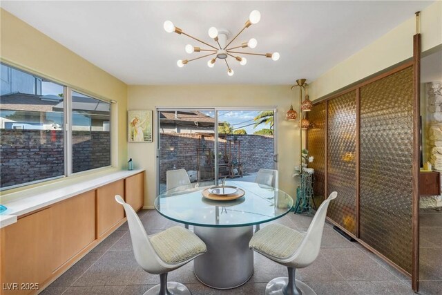 3586 Spencer St, Las Vegas, NV 89169 - dining room featuring a chandelier, granite finish floor, and visible vents