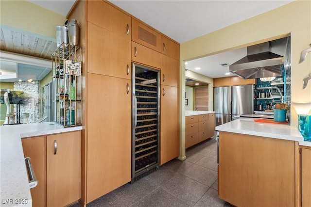 3586 Spencer St, Las Vegas, NV 89169 - kitchen with light countertops, freestanding refrigerator, beverage cooler, wall chimney range hood, and recessed lighting