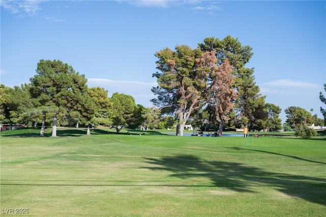 3586 Spencer St, Las Vegas, NV 89169 - view of home's community with a lawn, view of golf course, and view of wooded area