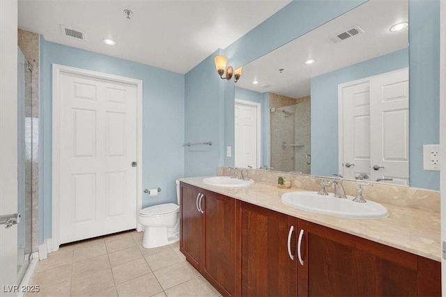 150 Las Vegas Blvd Unit 918, Las Vegas, NV 89101 - full bath with a stall shower, double vanity, tile patterned flooring, and toilet