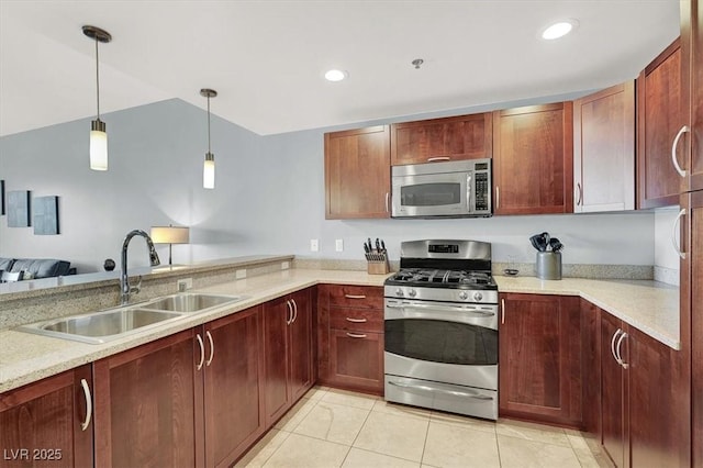 150 Las Vegas Blvd Unit 918, Las Vegas, NV 89101 - kitchen with appliances with stainless steel finishes, a sink, hanging light fixtures, light tile patterned floors, and a peninsula