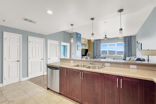 150 Las Vegas Blvd Unit 918, Las Vegas, NV 89101 - kitchen featuring stainless steel dishwasher, a sink, open floor plan, decorative light fixtures, and recessed lighting
