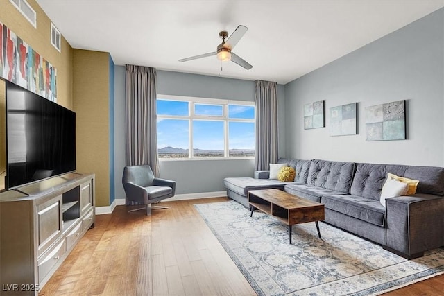 150 Las Vegas Blvd Unit 918, Las Vegas, NV 89101 - living area with light wood-style flooring, ceiling fan, and baseboards