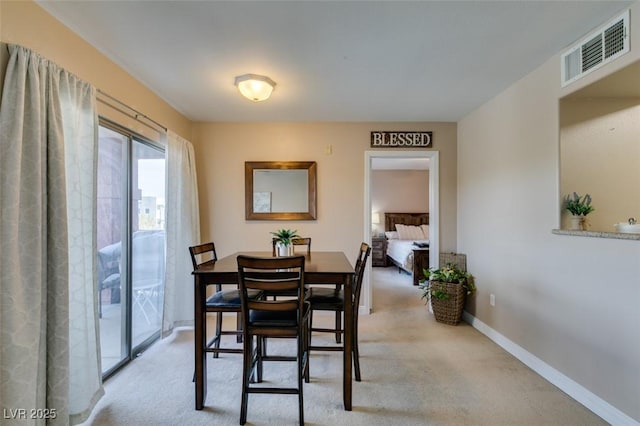 8000 Badura Ave Unit 2063, Las Vegas, NV 89113 - dining room featuring light carpet and baseboards