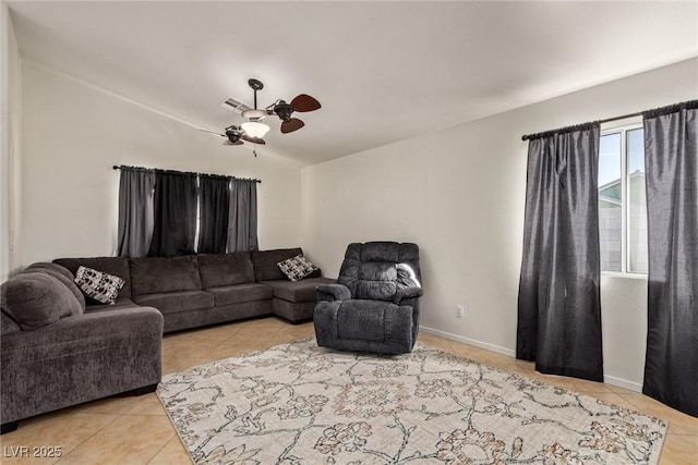 living area featuring visible vents, tile patterned floors, and ceiling fan