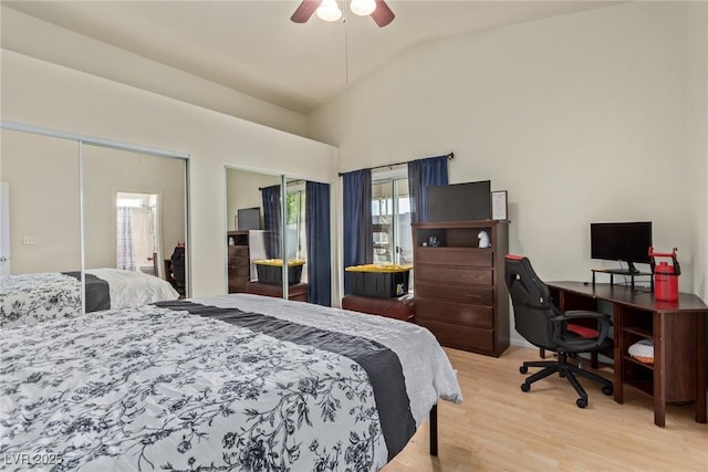 bedroom featuring ceiling fan, light wood-type flooring, and lofted ceiling