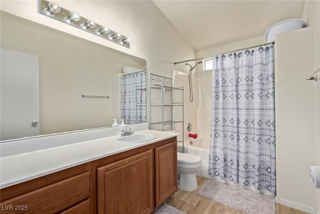 full bathroom featuring toilet, wood finished floors, vanity, and shower / bath combination with curtain