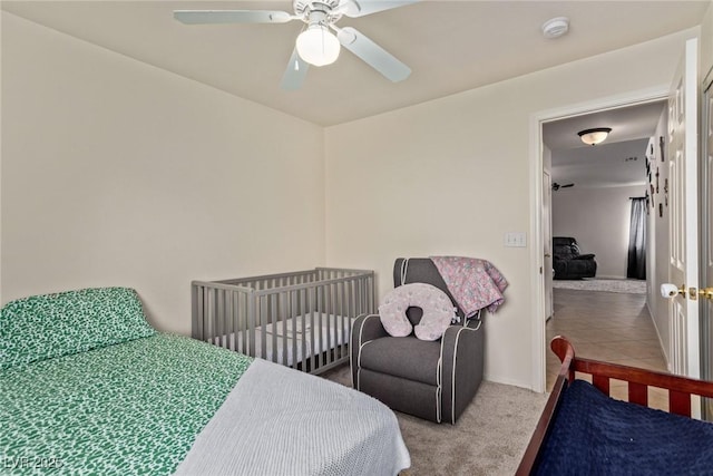bedroom featuring carpet flooring, baseboards, and ceiling fan