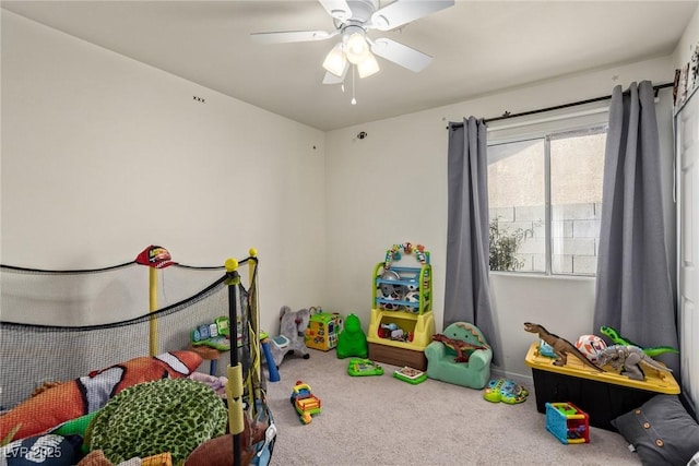 playroom featuring carpet flooring and a ceiling fan