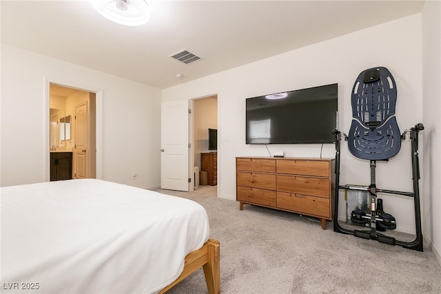 bedroom featuring light carpet, ensuite bathroom, baseboards, and visible vents