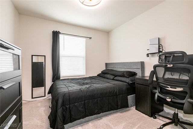 bedroom with light carpet