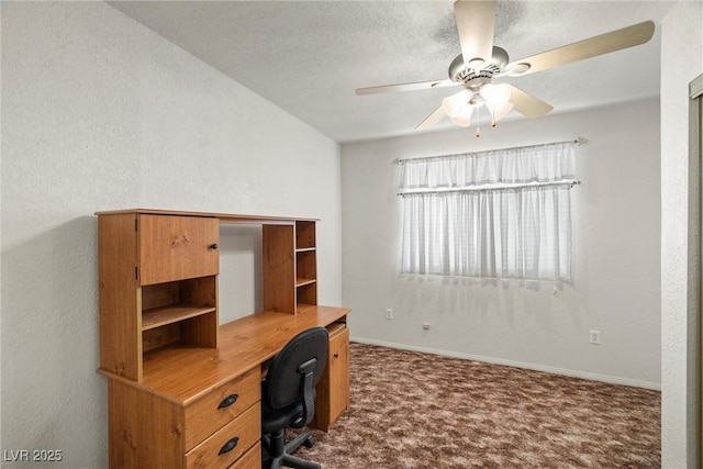 home office featuring baseboards, dark colored carpet, a textured ceiling, and ceiling fan