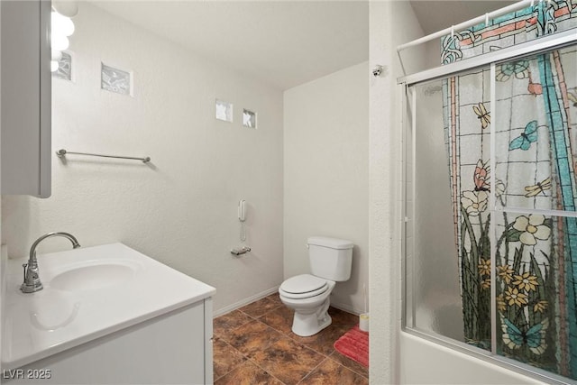 full bathroom with baseboards, enclosed tub / shower combo, toilet, and vanity