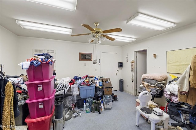 garage with visible vents and a ceiling fan