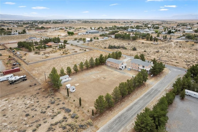 bird's eye view featuring a rural view and a desert view