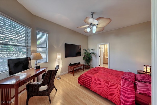 2064 Poetry Ave, Henderson, NV 89052 - bedroom with baseboards, light wood-style flooring, and ensuite bathroom