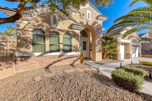 2064 Poetry Ave, Henderson, NV 89052 - mediterranean / spanish-style home with driveway and stucco siding