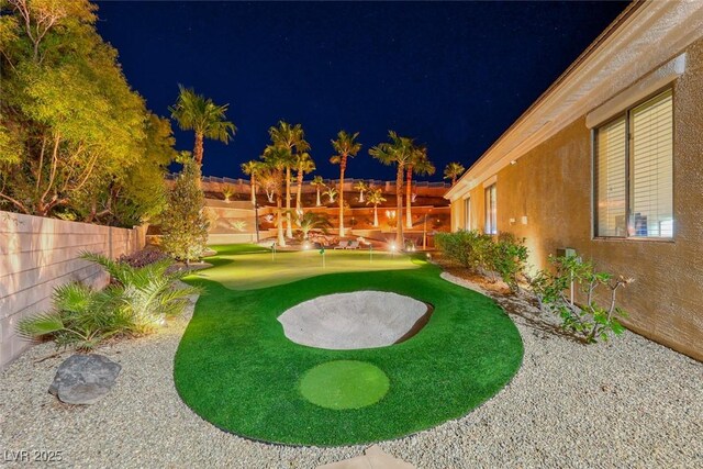 2064 Poetry Ave, Henderson, NV 89052 - yard at night with fence
