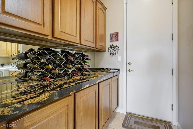 10524 Longwood Dr, Las Vegas, NV 89134 - interior space featuring washer and dryer and light tile patterned floors