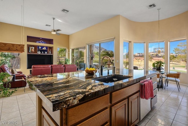 10524 Longwood Dr, Las Vegas, NV 89134 - kitchen with visible vents, a sink, ceiling fan with notable chandelier, and open floor plan