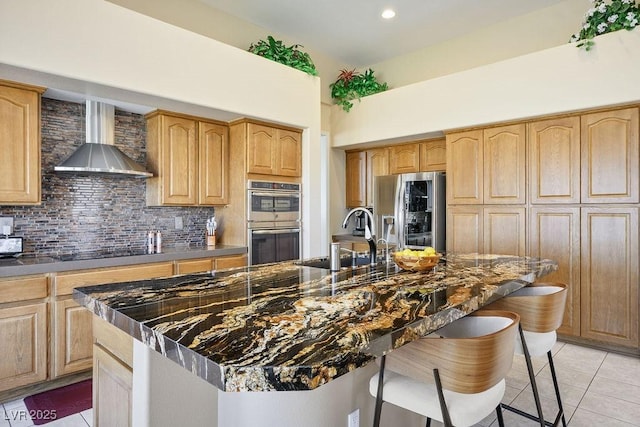 10524 Longwood Dr, Las Vegas, NV 89134 - kitchen with a breakfast bar, wall chimney exhaust hood, stainless steel appliances, a sink, and light tile patterned floors