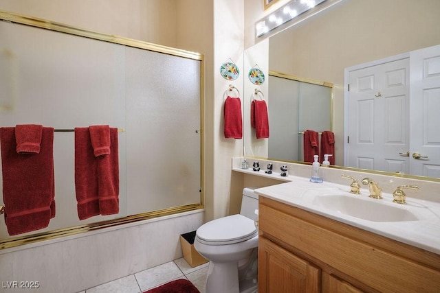 10524 Longwood Dr, Las Vegas, NV 89134 - bathroom featuring tile patterned flooring, vanity, toilet, and bath / shower combo with glass door